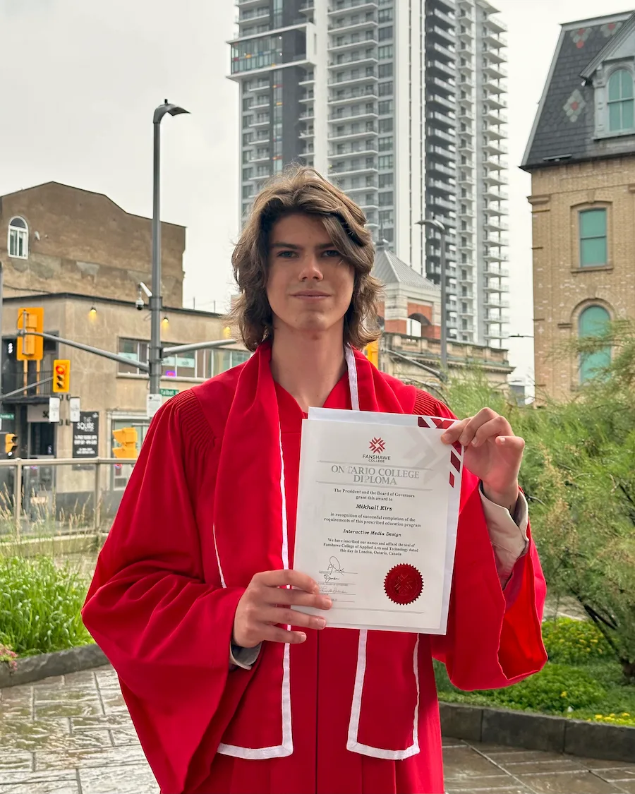 Mikhail Kirs with his Fanshawe College diploma