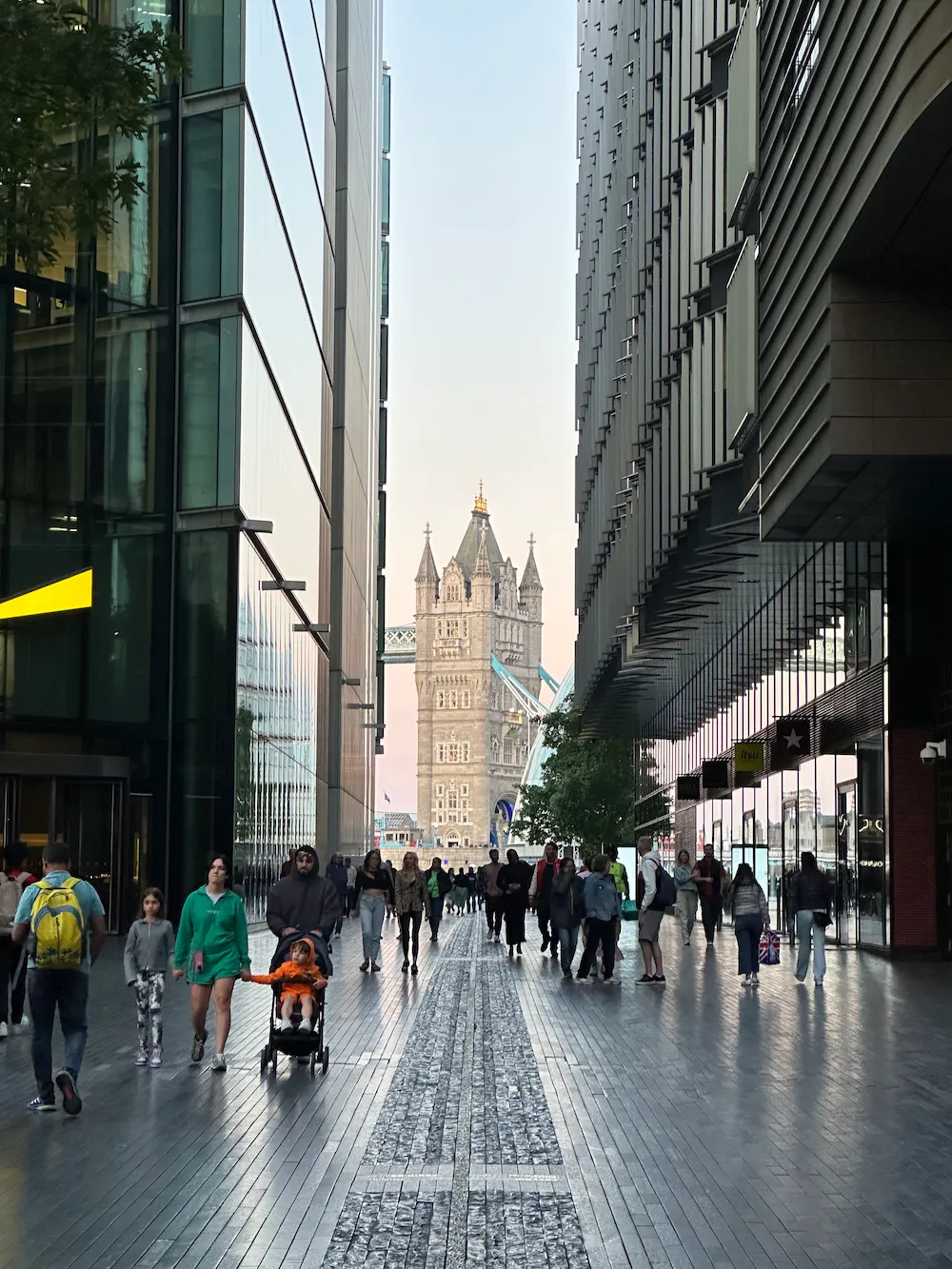 Tower Bridge framed by contemporary London architecture and everyday city life